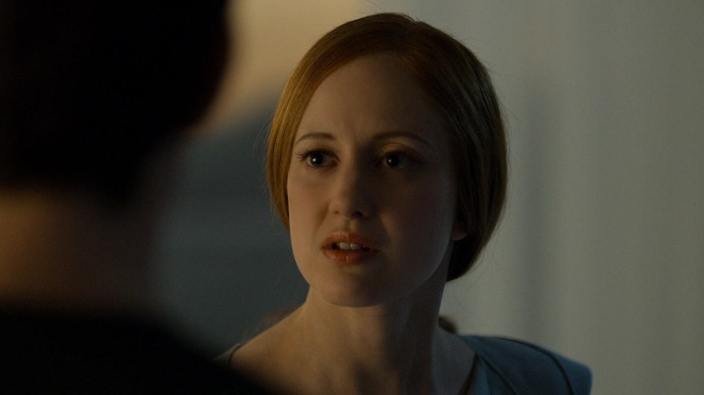 Andrea Riseborough talking to Tom Cruise