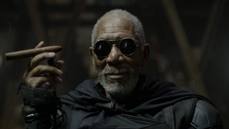 Morgan Freeman in sunglasses holding cigar