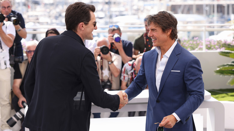 Joseph Kosinski and Tom Cruise attend cast photo call