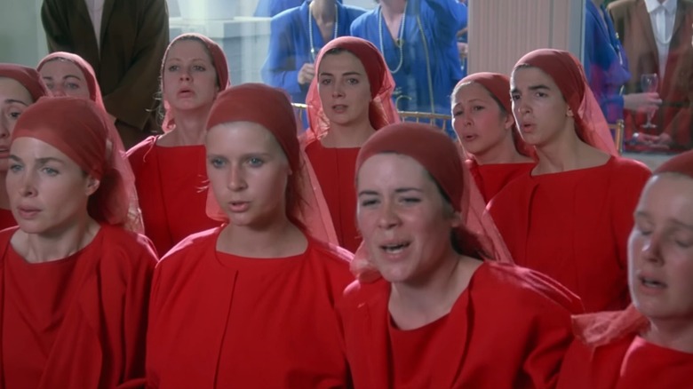 The Handmaids wearing red