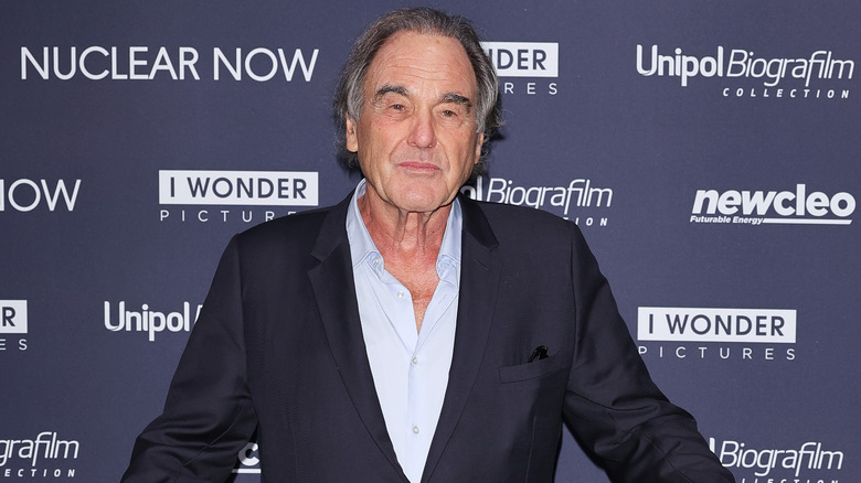 Oliver Stone smirking