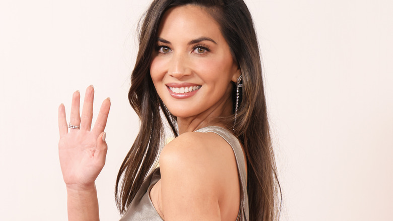 Olivia Munn waving