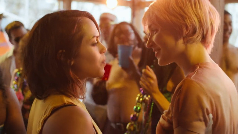 A girl smiles at Jackie at a Pride party