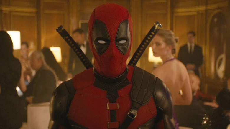 Deadpool walking through party