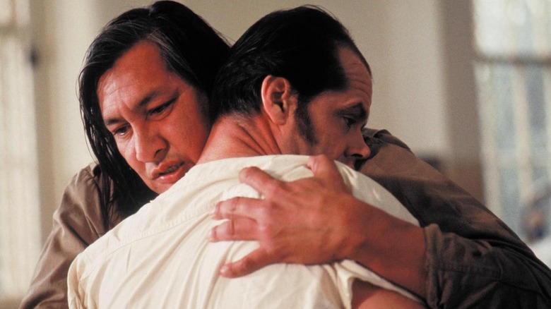 Jack Nicholson being hugged by Will Sampson