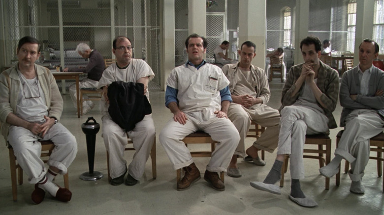 Jack Nicholson and patients sit in chairs looking surprised