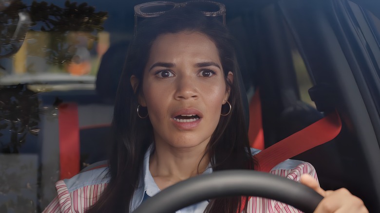 Gloria driving looking shocked