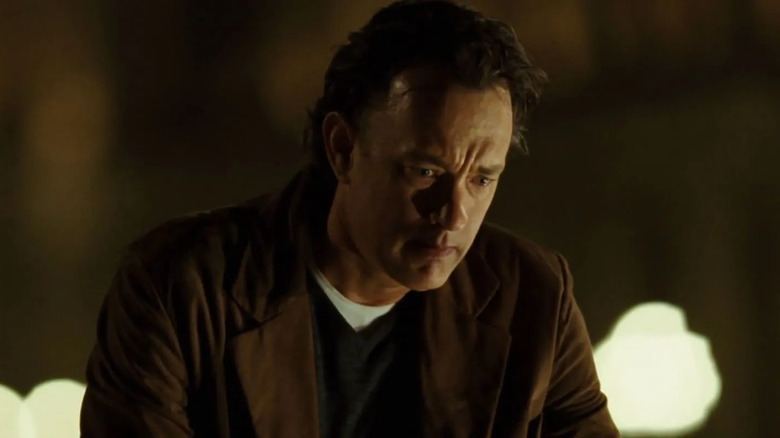 Robert Langdon kneeling