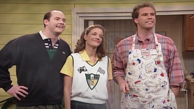 David Koechner, Nancy Walls, and Will Ferrell smiling into the distance