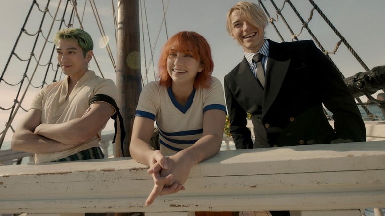 Zoro, Nami, Sanji smiling boat