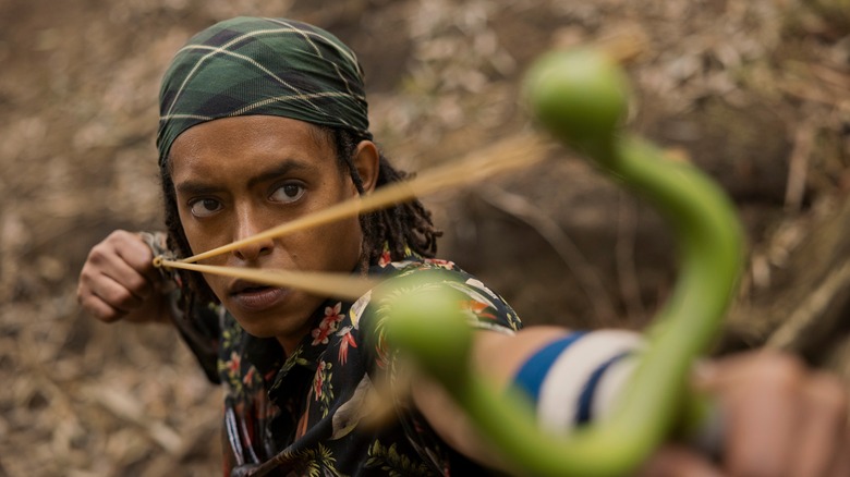 Usopp readying a slingshot