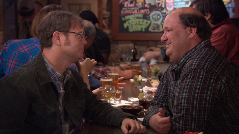 Dwight and Kevin talking at bar