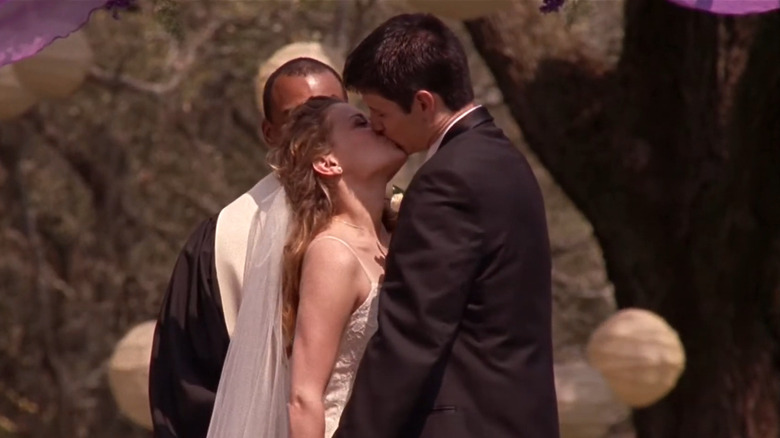 Haley kissing Nathan at wedding