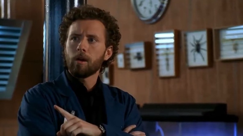 Dr. Hodgins talks while pointing