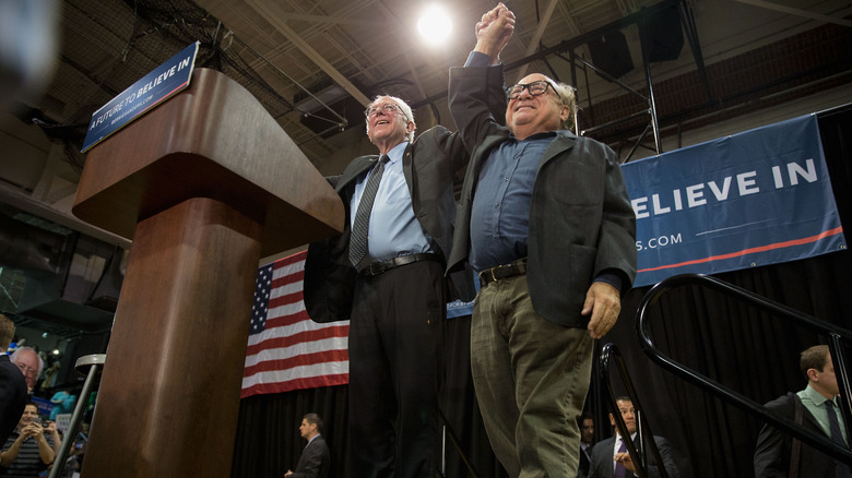 Bernie Sanders and Danny DeVito at a campaign event