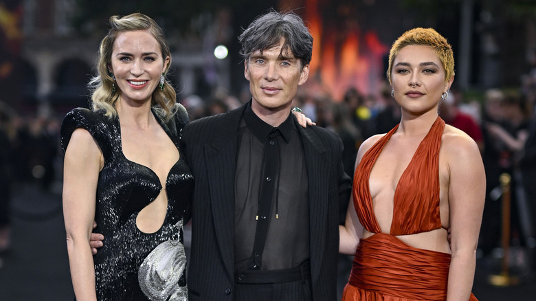 Emily Blunt, Cillian Murphy, and Florence Pugh looking ahead