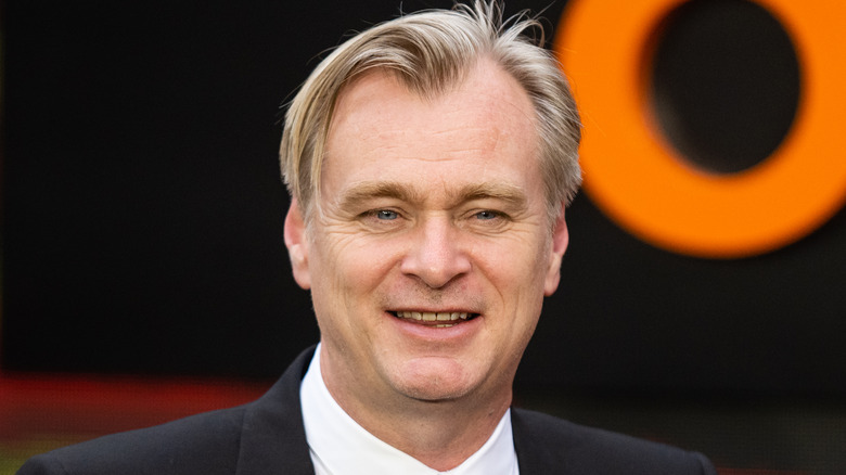 Christopher Nolan at Oppenheimer event smiling