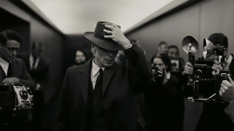 Oppenheimer holding his hat