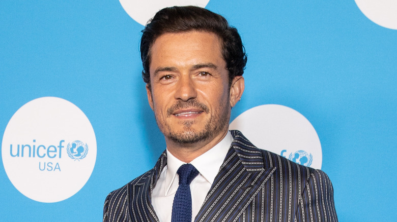 Orlando Bloom wearing striped suit