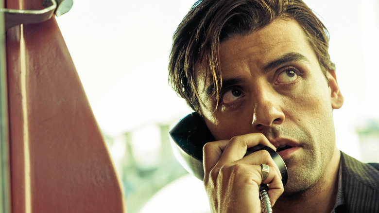 Oscar Isaac takes a phone call