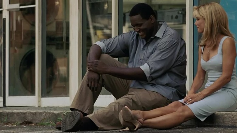 Michael Oher laughing with Leigh Anne Tuohy