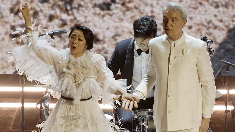 Stephanie Hsu and David Byrne performing onstage