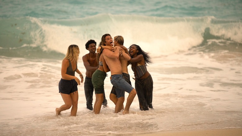 The Pogues embracing on the beach