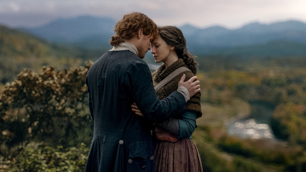 Claire and Jamie embracing