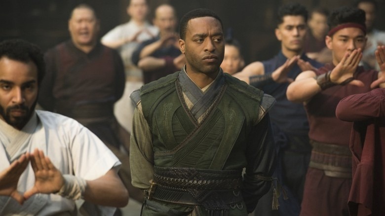 Mordo walks through a group of recruits in "Doctor Strange" (2016)