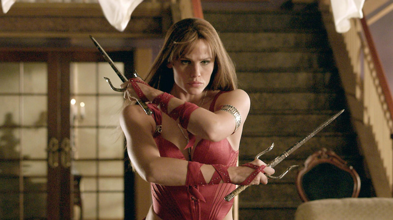 elektra with weapons crossed