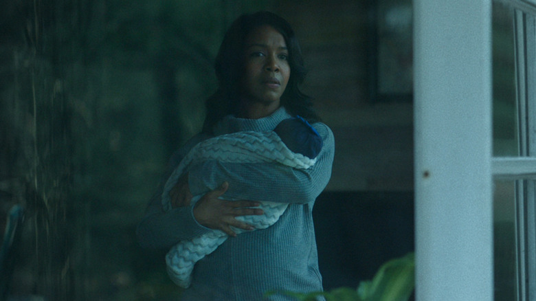Maya Miller holding baby