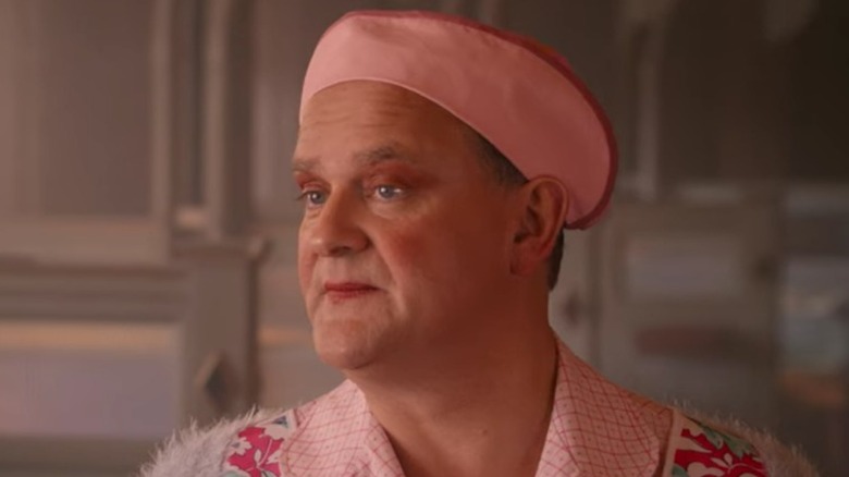 Hugh Bonneville wearing pink hat 