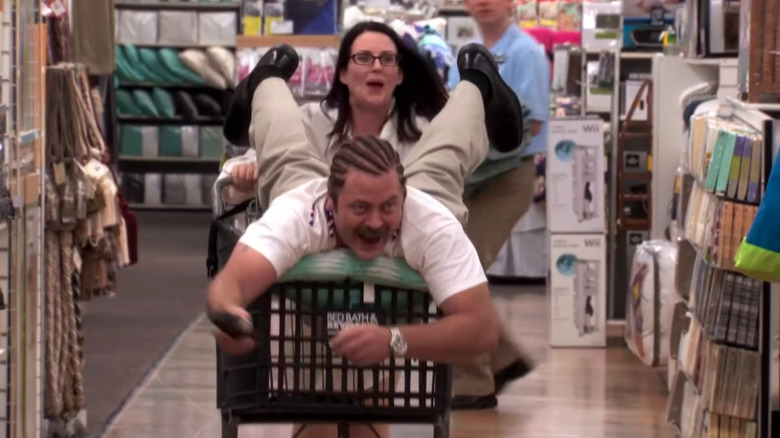 Tammy wheeling Ron in a cart