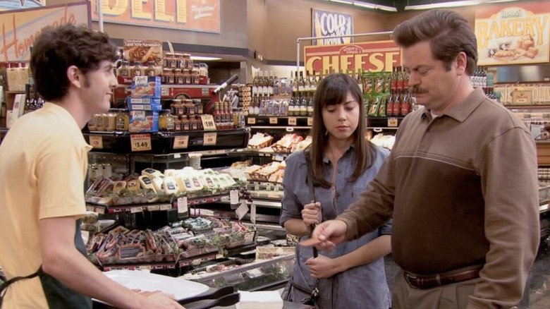 Ron throws out jerky samples as April looks on