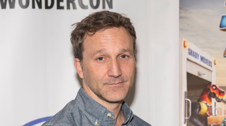 Breckin Meyer posing at a convention