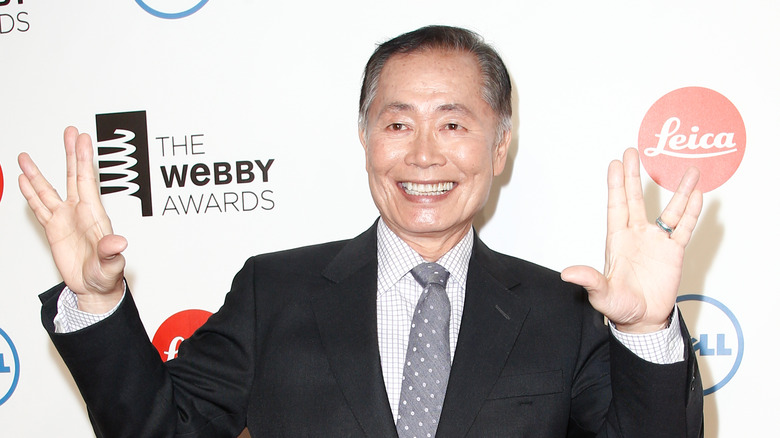 George Takei making the Vulcan symbol 