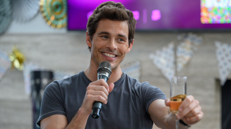 James Marsden holding wine glass