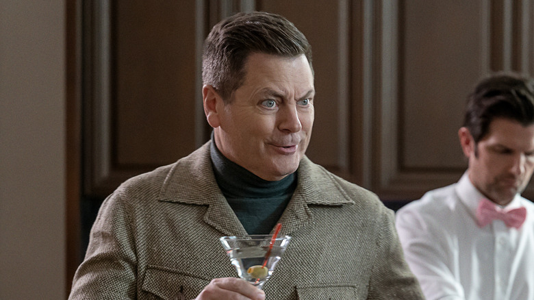 Nick Offerman holding a cocktail