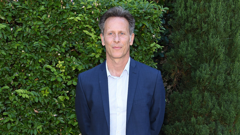 Steven Weber posing outdoors