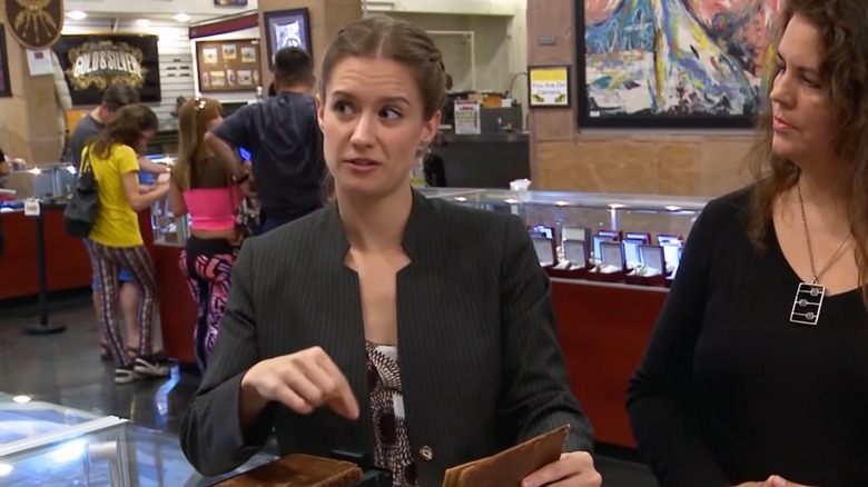 Rebecca Romney pointing at book