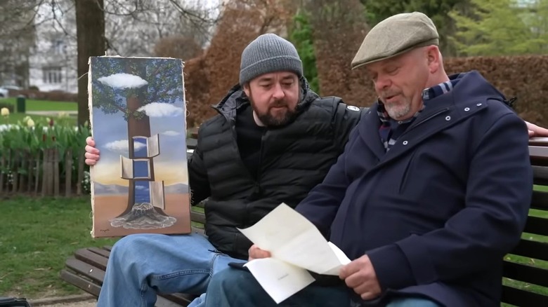 Chumlee sits next to Harrison on a park bench