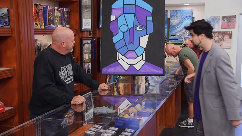 Rick Harrison looking at the Prince painting