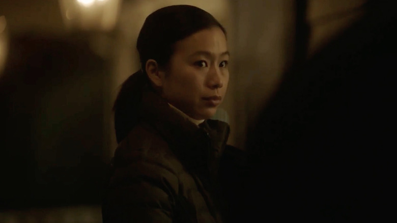 Detective Sophie Song Annie Chang looks at her partner in Peacemaker