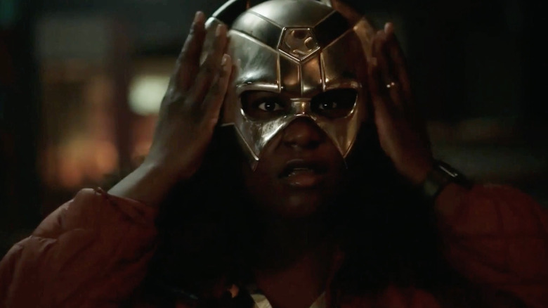 Leota Adebayo puts on Peacemaker's helmet