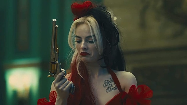 Margot Robbie holding a gun in "The Suicide Squad"