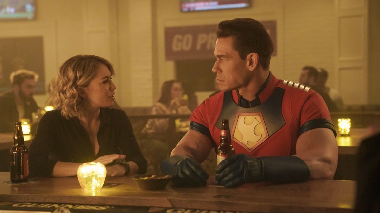 Jennifer Holland and John Cena having drinks in "Peacemaker"