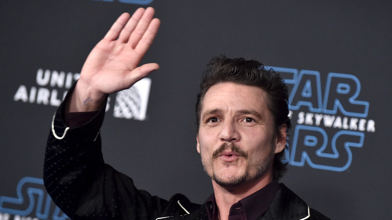 Pedro Pascal waves at premiere