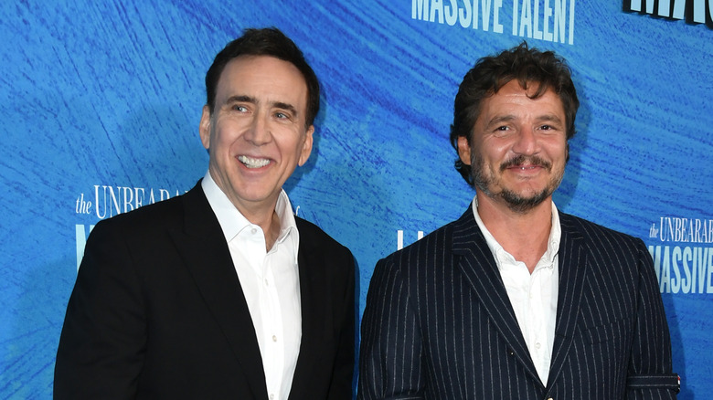 Pedro Pascal stands with Nick Cage