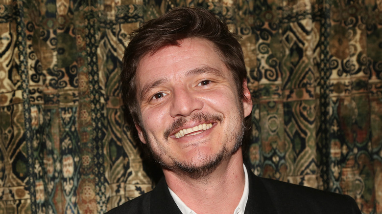 Pedro Pascal smiles at premiere