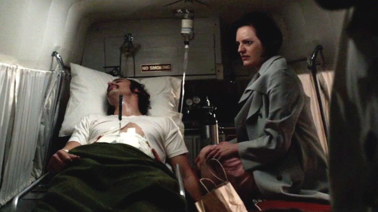 Abe and Peggy ride in ambulance